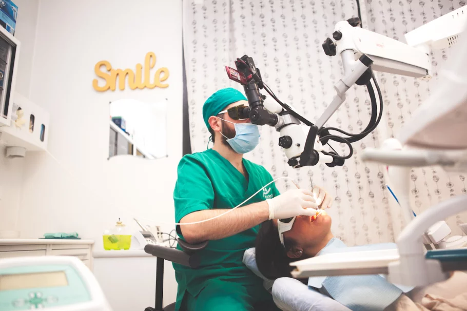 Dr Stori operating with Microscope